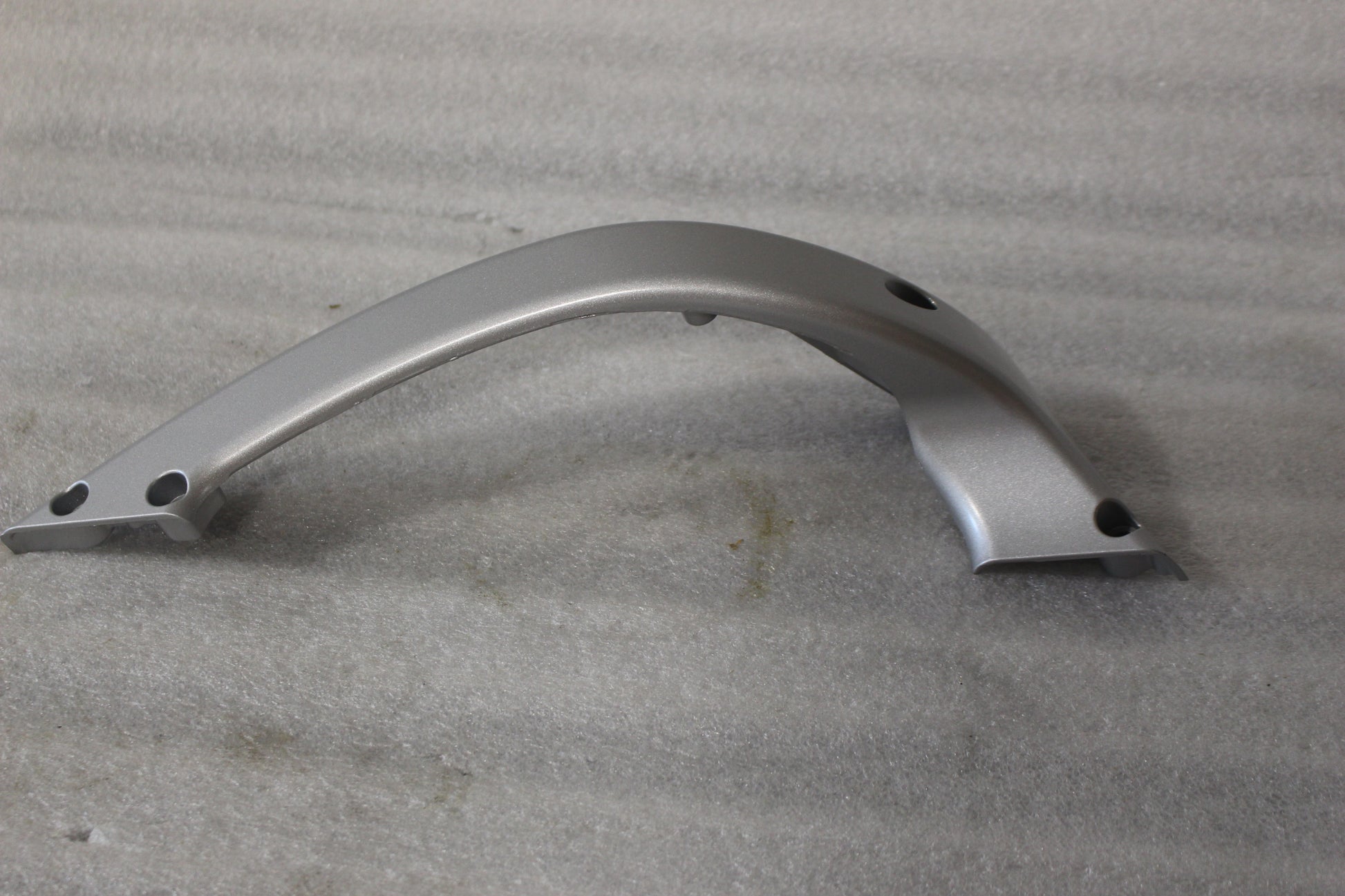 K0101.02A8 NEW OEM 2004-2007 BUELL XB SWINGARM BRACE FLUID SILVER